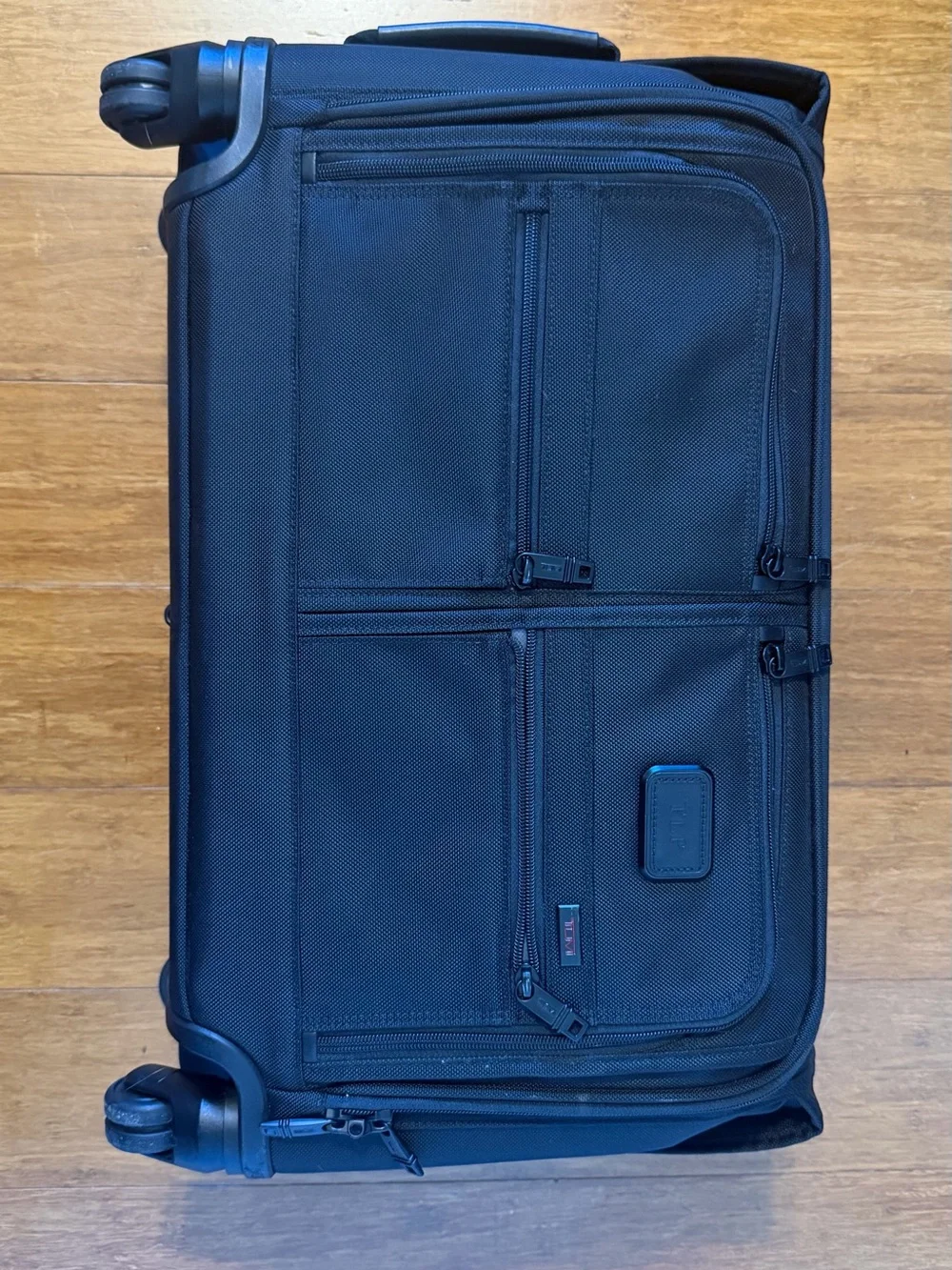 Tumi Black Garment Spinnerwith Front Organization Pockets